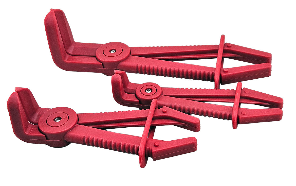 A set of three red plastic hose clamp pliers  for clamping flexible hose lines on vehicles.