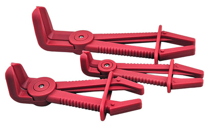 A set of three red plastic hose clamp pliers  for clamping flexible hose lines on vehicles.